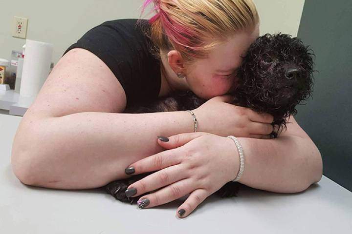 Amber Kimmerly says her poodle Ozzy had to be euthanized after it was found severely beaten in her backyard.
