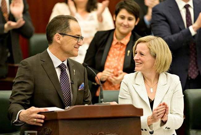 Alberta Premier Rachel Notley smiles as Minister of Finance Joe Ceci delivers the 2016 budget in Edmonton on Thursday April 14, 2016.