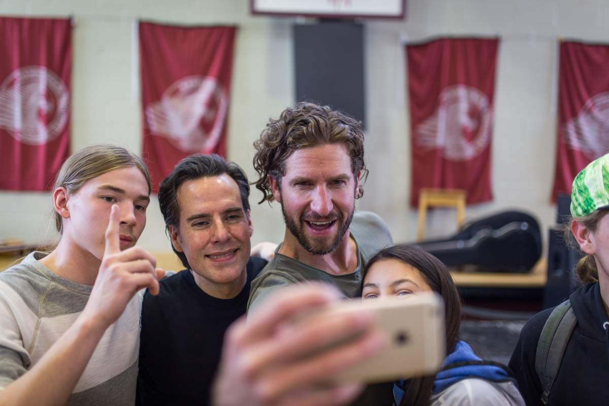 Singer Jonas and guitarist Corey Diabo take a selfie with students at Kahnawake Survival School, Wednesday, March 23, 2016.