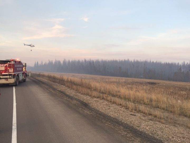 Fire crews battle a wildfire near Boyle, Alta. on April, 18, 2016. The blaze  left Highway 63 impassable for a couple of hours.