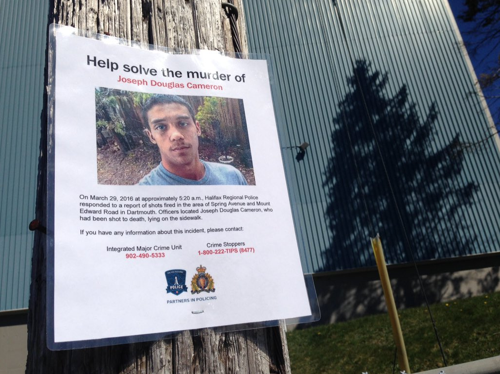 A poster asking for help solving the Joseph Cameron homicide. 
