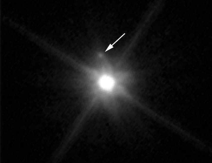 This Hubble image reveals the first moon ever discovered around the dwarf planet Makemake.