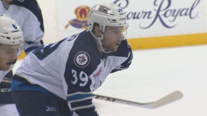 Manitoba Moose forward Dan DeSalvo lines up for the faceoff.