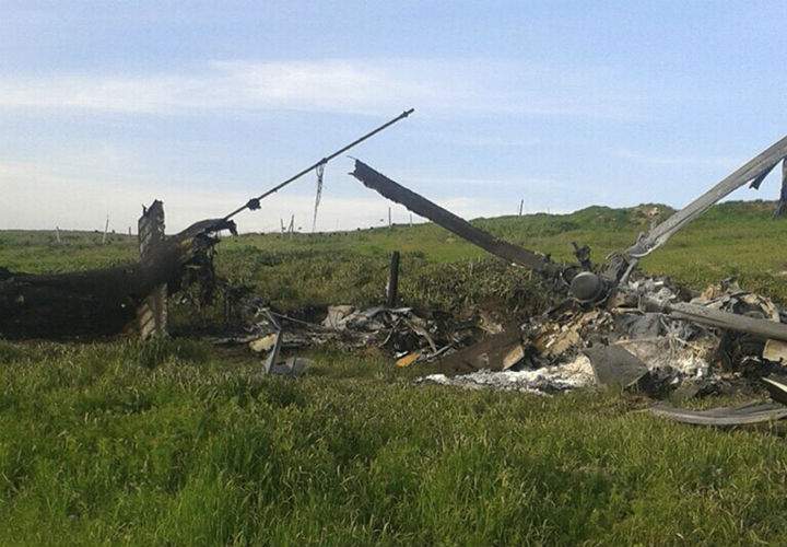 Remains of a downed Azerbaijani forces helicopter lies in a field in the separatist Nagorno-Karabakh region, on Saturday, April 2, 2016. In a statement, Azerbaijan’s Defense Ministry said 12 of its soldiers “became shards” (Muslim martyrs) and said one of its helicopters was shot down.