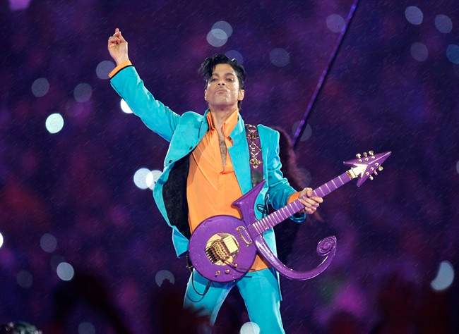  In this Feb. 4, 2007 file photo, Prince performs during the halftime show at the Super Bowl XLI football game at Dolphin Stadium in Miami. 