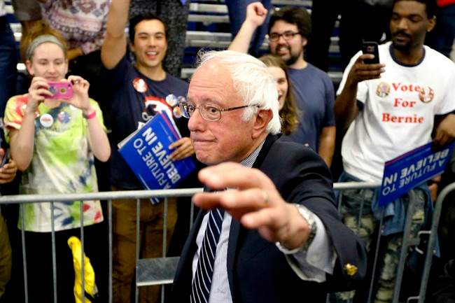 Democratic presidential candidate Sen. Bernie Sanders, I-Vt., waves as he leaves a campaign rally at Fitzgerald Fieldhouse on the University of Pittsburgh campus, Monday, April 25, 2016, in Pittsburgh.