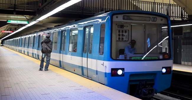A subway train is seen pulling into a station Thursday, March 24, 2016 in Montreal. Montreal's original subway cars are set to retire after 50 years of service -- and the city's transport agency is looking to members of the public to give them a second life.