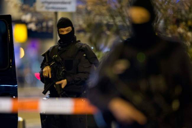 File photo shows hooded security forces guarding a part of Schiphol Aiport in Amsterdam, Netherlands, on Wednesday, April 13, 2016. 