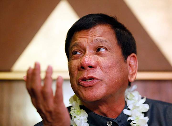 In this March 10, 2016 photo, Davao City Mayor Rodrigo Duterte talks to the media in Manila, Philippines. 