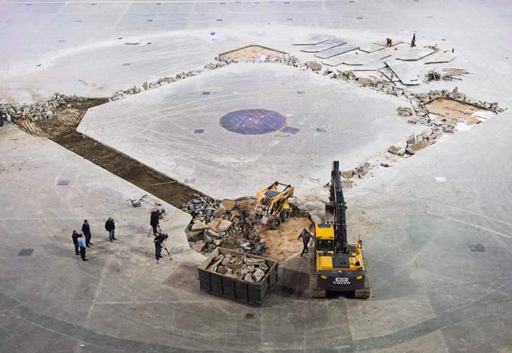 Construction workers hammer out concrete as they install the new dirt infield for the Toronto Blue Jays upcoming season at the Rogers Centre in Toronto on Wednesday, February 10, 2016.