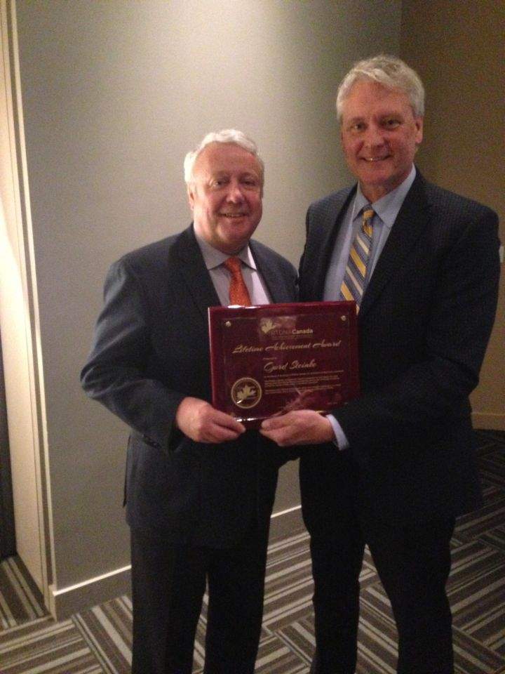 Global Edmonton station manager Tim Spelliscy (left) poses with Global News Edmonton anchor Gord Steinke (right) who was given a lifetime achievement award at the RTDNA Prairie Regional Awards in Medicine Hat, Alta. on April 23, 2016.