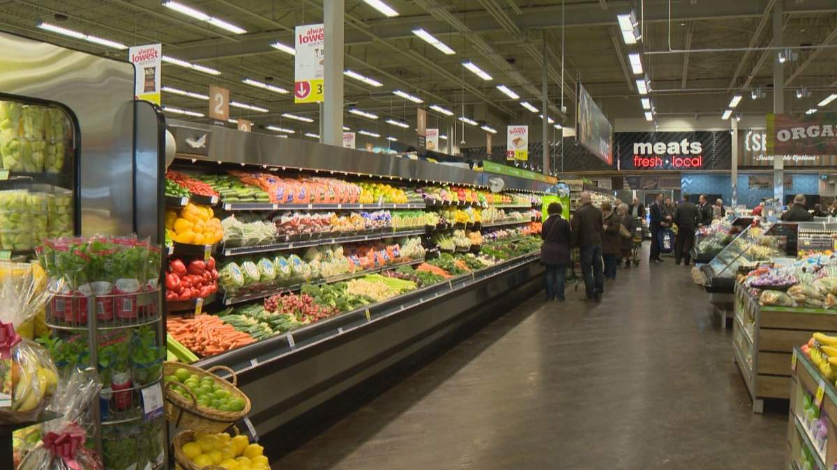 Shoppers check out the produce section at the province's first Save On Foods.