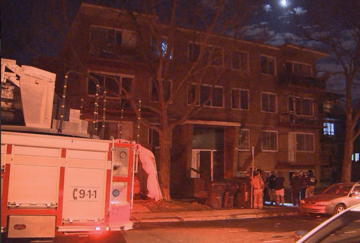 The Montreal police arson squad investigates after a fire raged through two apartment buildings in CDN-NDG, Sunday, April 24, 2016.