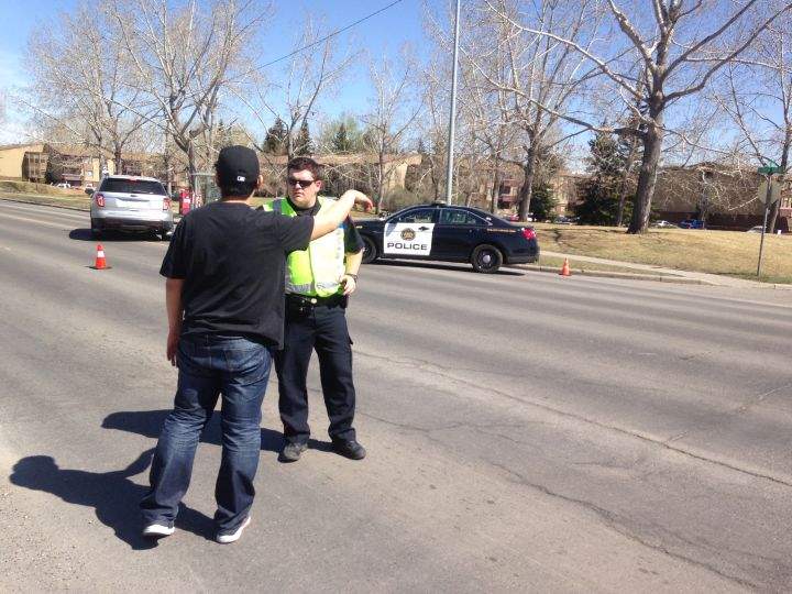 Calgary police on the scene after a suspicious military item was removed from a southwest property April 19, 2016.