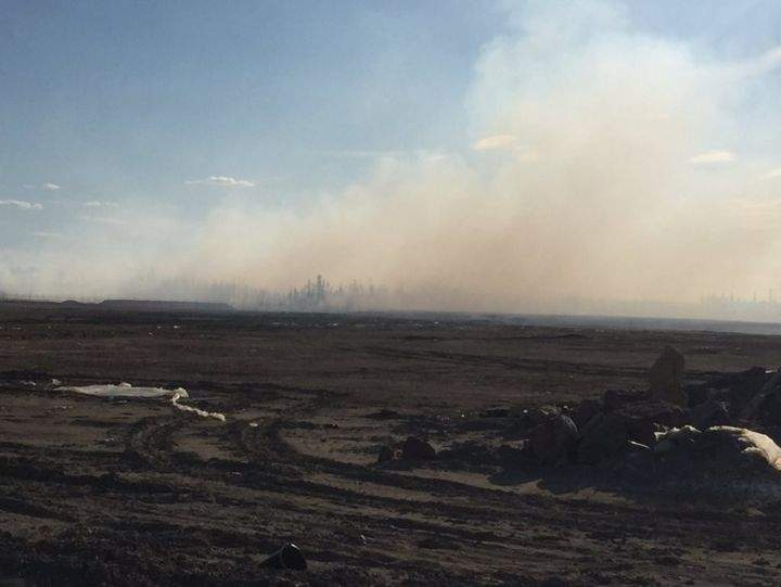 Smoke is seen coming from a fire burning near the Fort McMurray suburb of Timberlea on April 29, 2016.