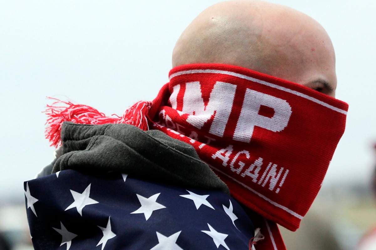 Anthony Gravitte of Geneva, N.Y., waits for a Donald Trump rally to begin on Sunday, April 10, 2016, in Rochester, N.Y. 