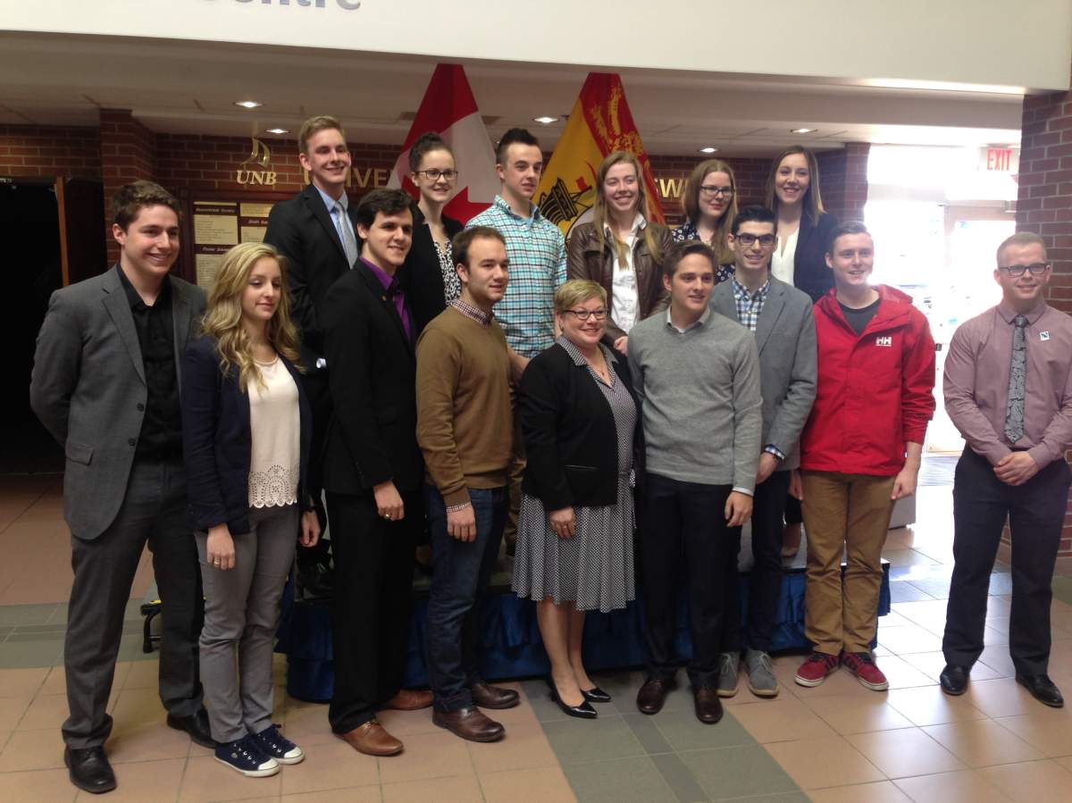 Francine Landry poses for picture with students