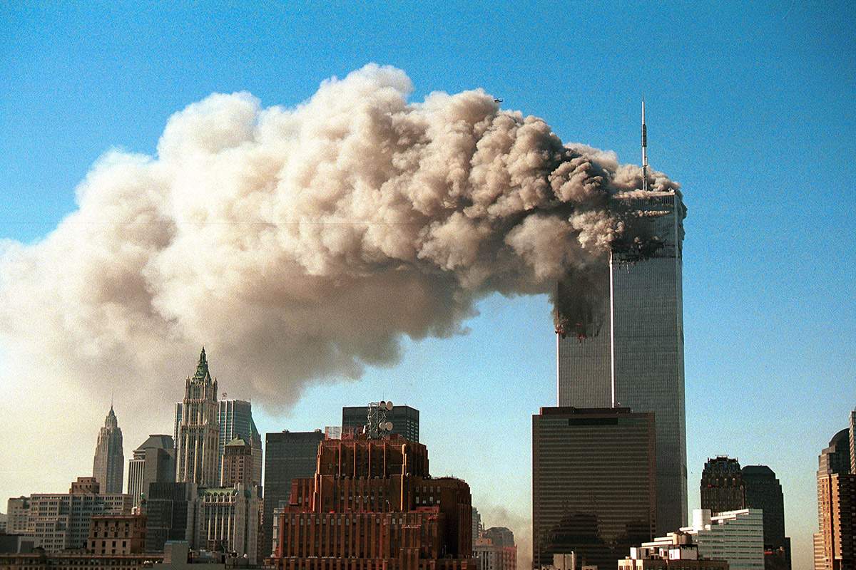 Smoke pours from the twin towers of the World Trade Center after they were hit by two hijacked airliners in a terrorist attack September 11, 2001 in New York City.  