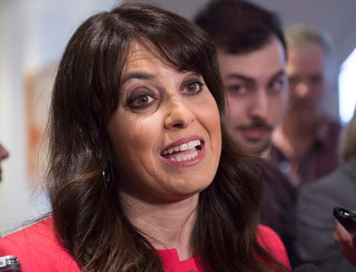Parti Québécois MNA Véronique Hivon responds to reporter questions, Friday, May 6, 2016 at the entrance of a special caucus meeting in Quebec City.