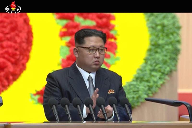 In this frame taken from TV, North Korean leader Kim Jong Un applauds during the congress in Pyongyang, North Korea, Saturday May 7, 2016. 