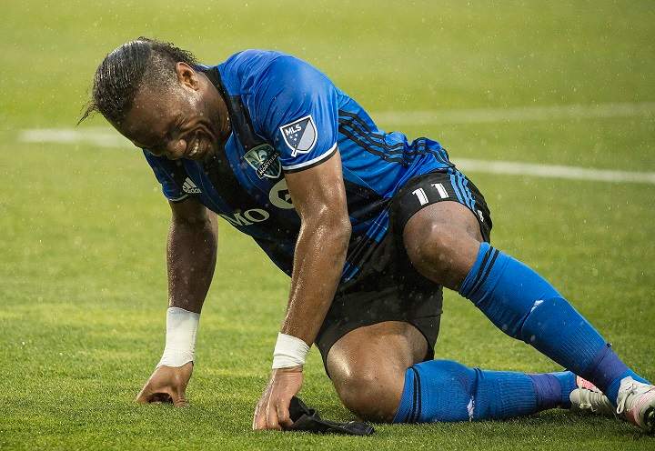 Montreal Impact’s Didier Drogba reacts in pain after suffering an injury during second half MLS soccer action against the Philadelphia Union in Montreal, Saturday, May 14, 2016. THE CANADIAN PRESS/Graham Hughes
