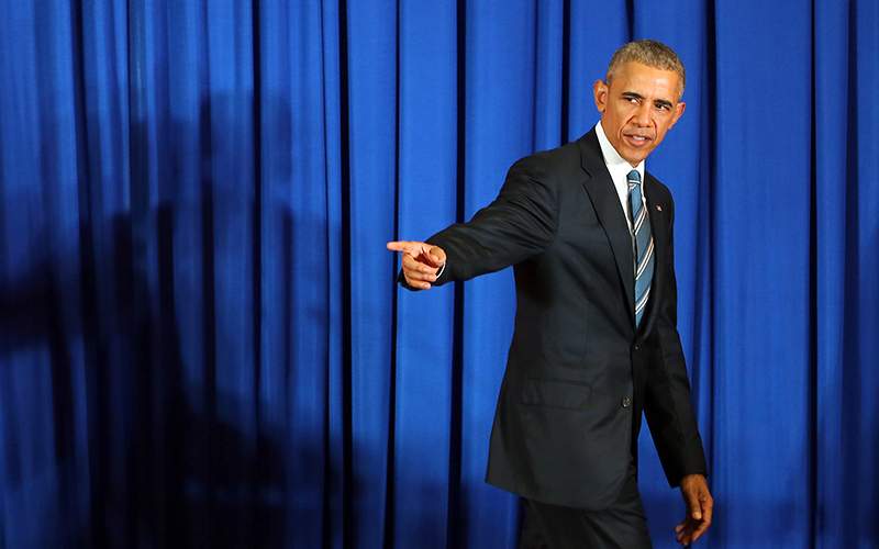 US President Barack Obama leaves the stage after a press conference at the International Convention Center in Hanoi, Vietnam, 23 May 2016. 