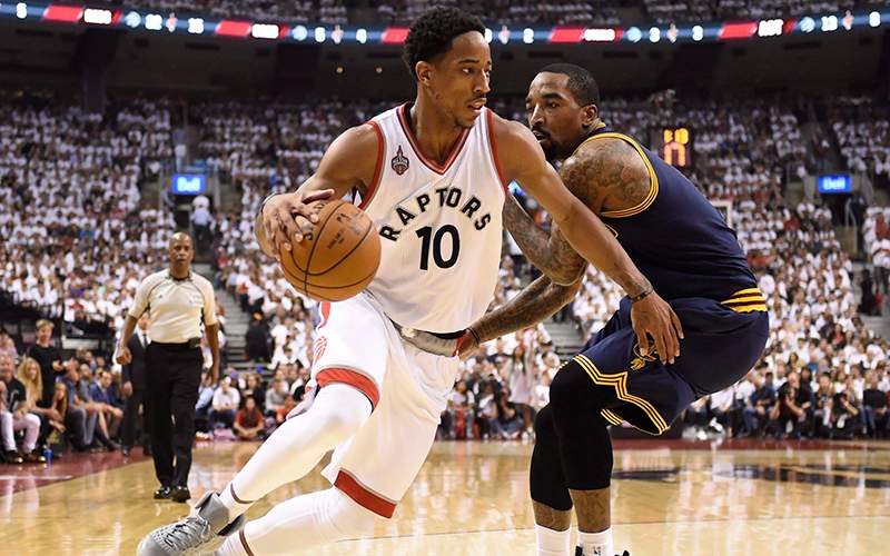Toronto Raptors guard DeMar DeRozan drives around Cleveland Cavaliers guard-forward J.R. Smith during first half Eastern Conference final NBA playoff basketball action in Toronto on Monday, May 23, 2016. 