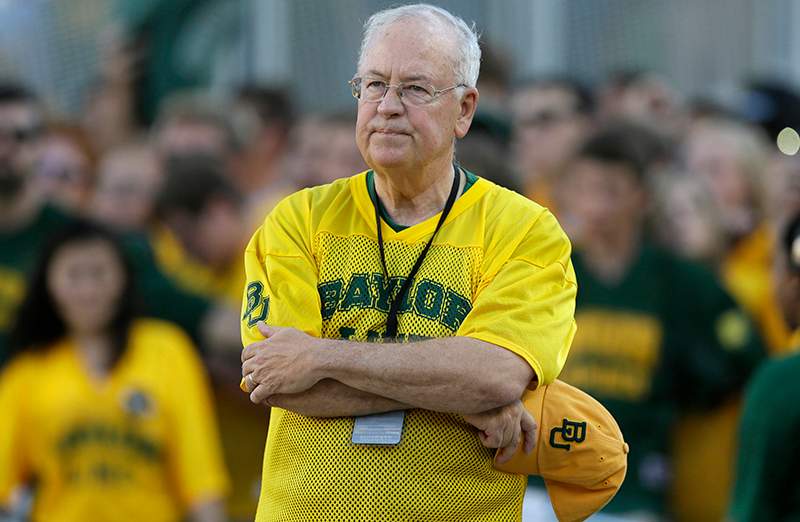 Baylor President Ken Starr waits to run onto the field before an NCAA college football game in Waco, Texas. 