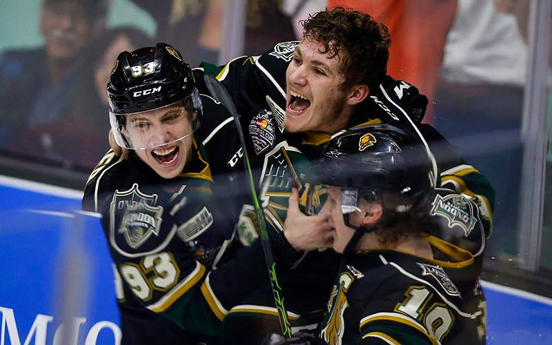 London Knights' Matthew Tkachuk, centre, celebrates the game-winning goal in the team's overtime victory in CHL Memorial Cup championship game hockey action against the Rouyn-Noranda Huskies in Red Deer, Sunday, May 29, 2016.