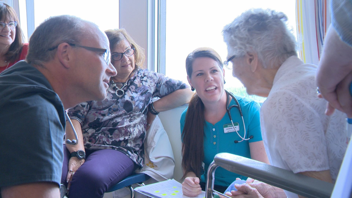 Agnes Weber receives her daily bedside check-up as part of the new accountable care unit.