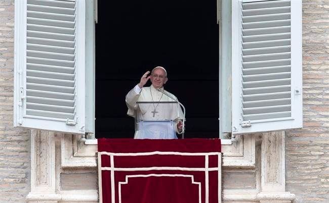 Pope Francis delivers his blessing during the Regina Coeli prayer from his studio's window overlooking St. Peter's Square, at the Vatican, Sunday, May 1, 2016.