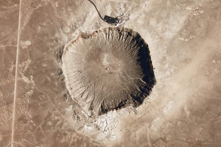 Meteor Crater is one of the youngest and best-preserved impact craters on Earth. The crater formed roughly 50,000 years ago when a 30-meter-wide, iron-rich meteor weighing 100,000 tons struck the Arizona desert at an estimated 20 kilometers per second.