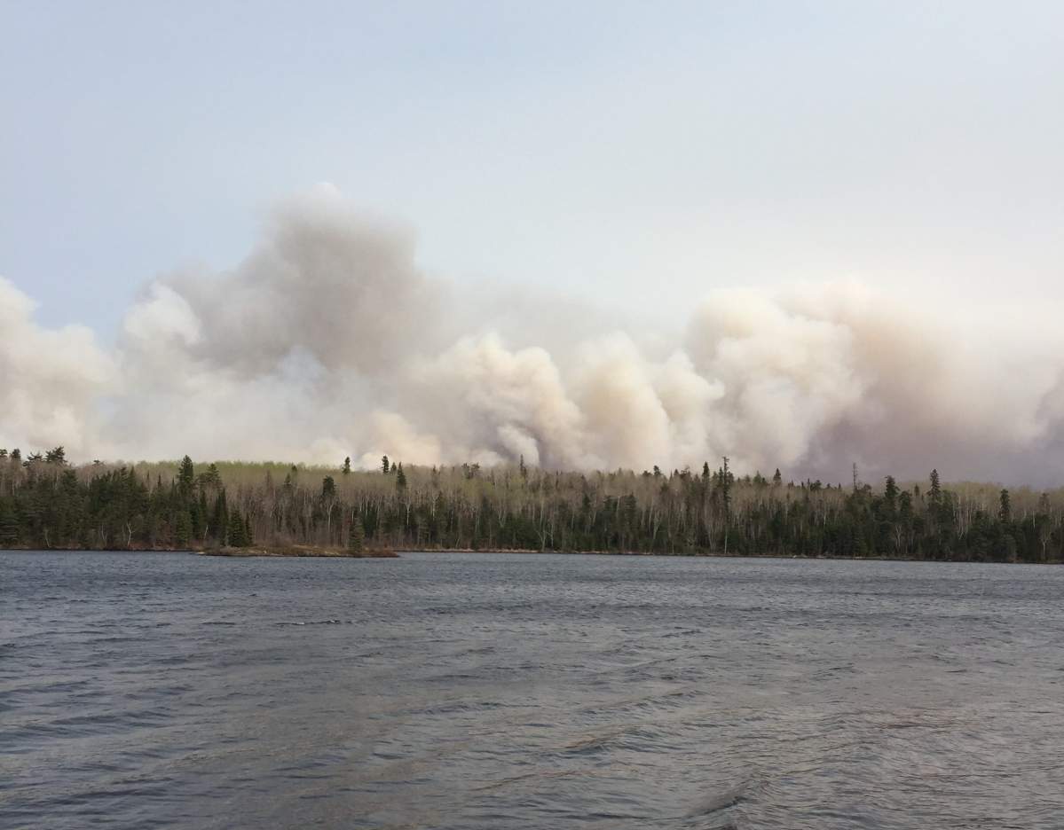 Smoke rises into the sky as 10,000 hectare fire east of Beresford Lake.