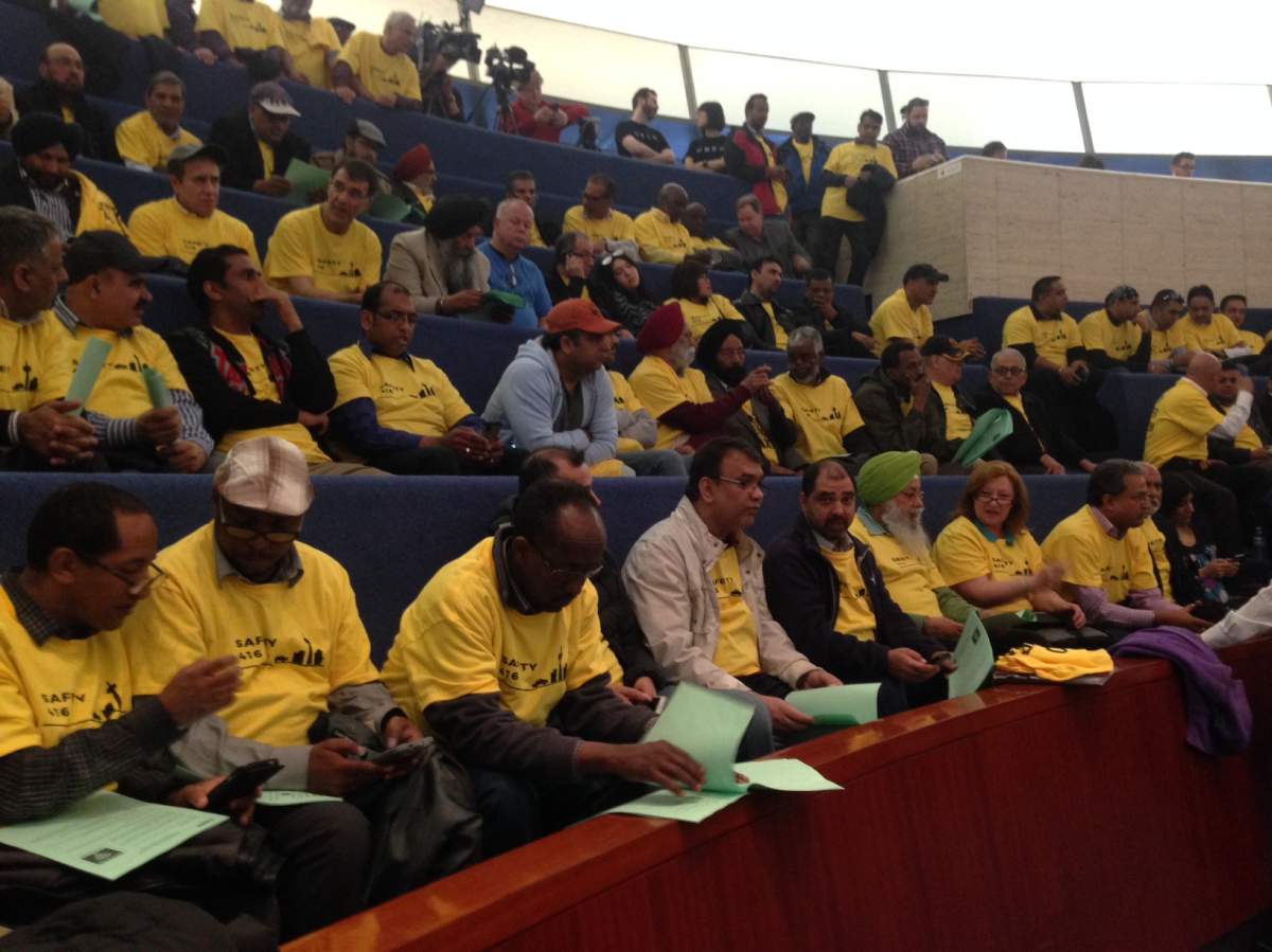 Taxi industry supporters are seen at Toronto city hall on May 3, 2016. 