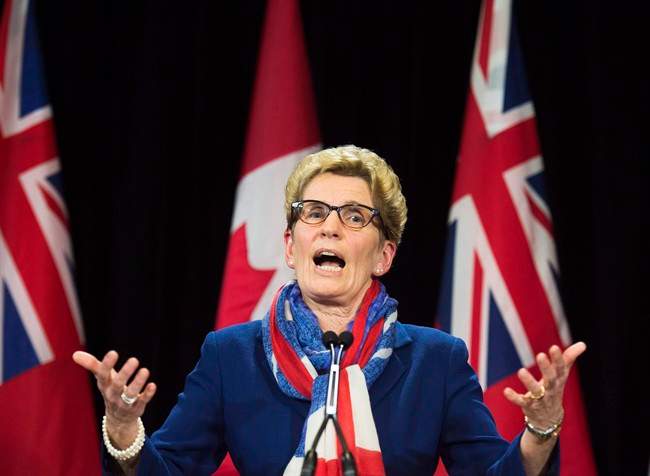 Ontario Premier Kathleen Wynne speaks during a press conference at Queen's Park in Toronto in an April 11, 2016, file photo.