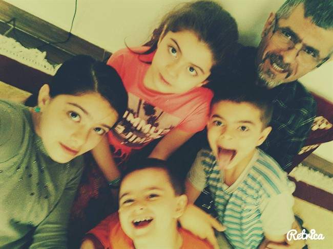 Sharvahn Azer, clockwise from top left, Rojevahn Azer, Saren Azer, Dersim Azer and Meitan Azer pose in this undated handout photo from Facebook community page. The mother of four Vancouver Island siblings says photographs posted online of them and their fugitive father could be a break in the case. A Canada-wide warrant remains in place for Saren Azer, a well-known Canadian doctor of Iranian descent, for alleged abduction in contravention of a custody order.