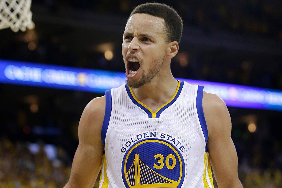 Golden State Warriors guard Stephen Curry (30) reacts after Shaun Livingston scored against the Oklahoma City Thunder during the second half.