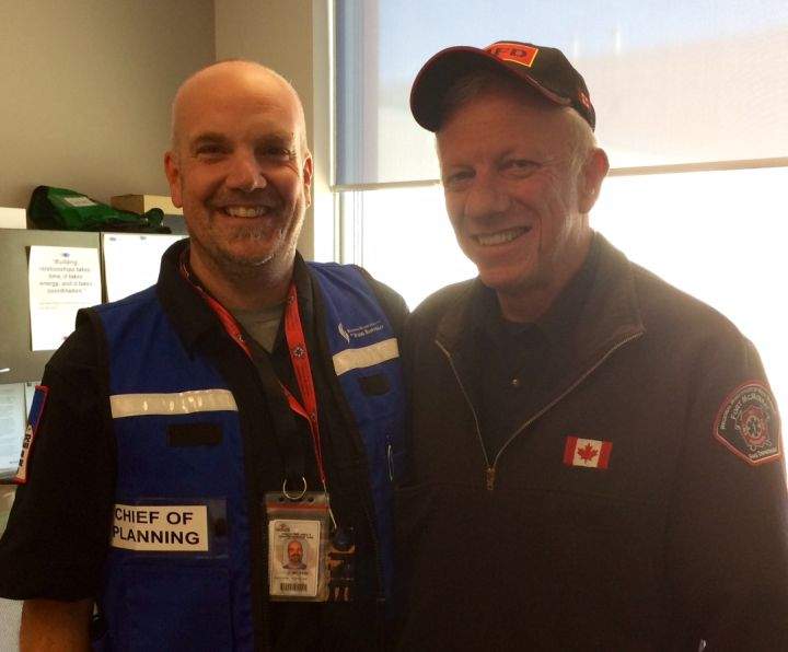 Incident Management Team member Daryl Black and Wood Buffalo Fire Chief Darby Allen.