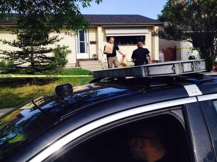 Forensic investigators bring out physical evidence at the scene of a fatal domestic incident in Calgary’s northeast on May 25, 2016.