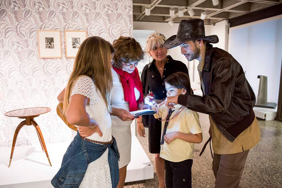 A family solves a puzzle during the Night At The Museum event at Montreal Museum of Fine Arts.