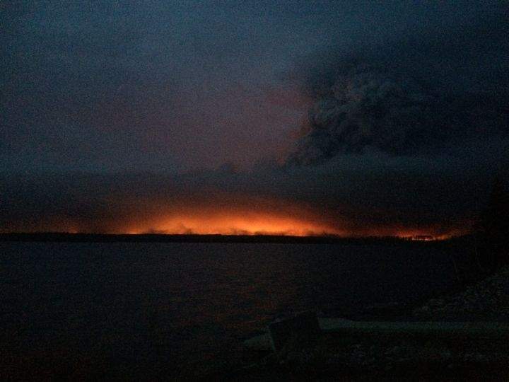 A fiery scene over Gregoire Lake as flames and smoke from a wildfire hang over Fort McMurray on Wednesday, May 4, 2016.