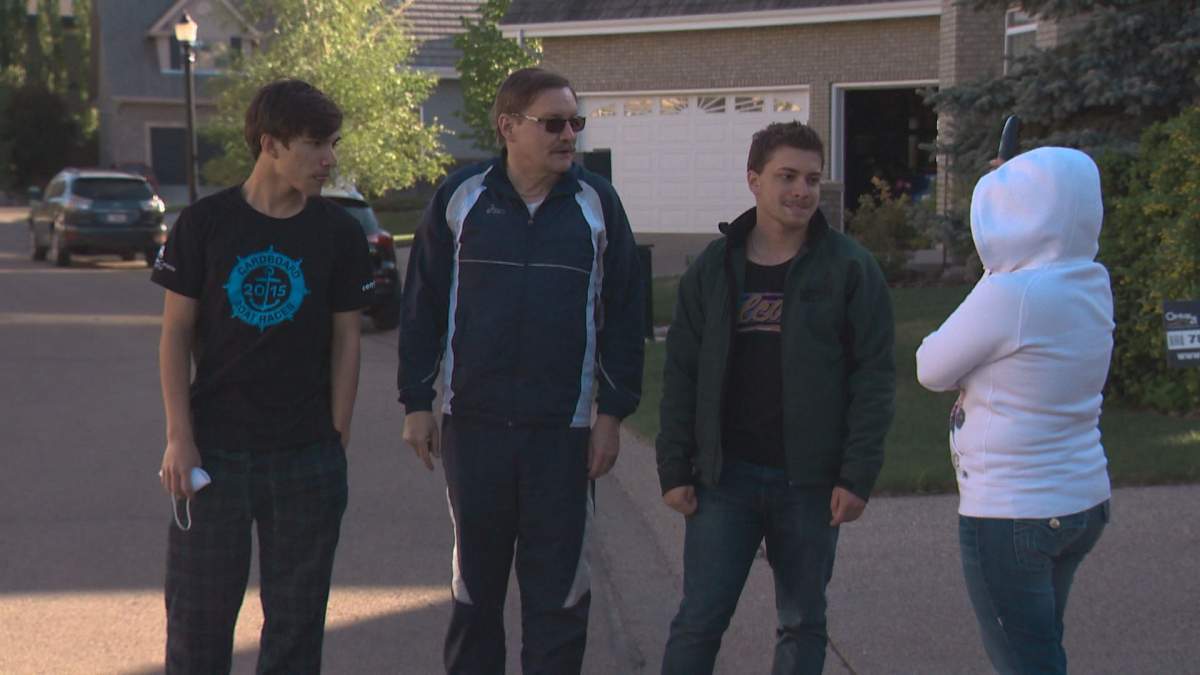 Residents jump into action fighting a stubborn grass fire with garden hoses in West Edmonton Sunday night.