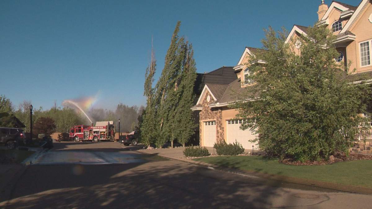 Fire in Wolf Willow damages homes, one of several fires burning in Edmonton’s River Valley Sunday - image