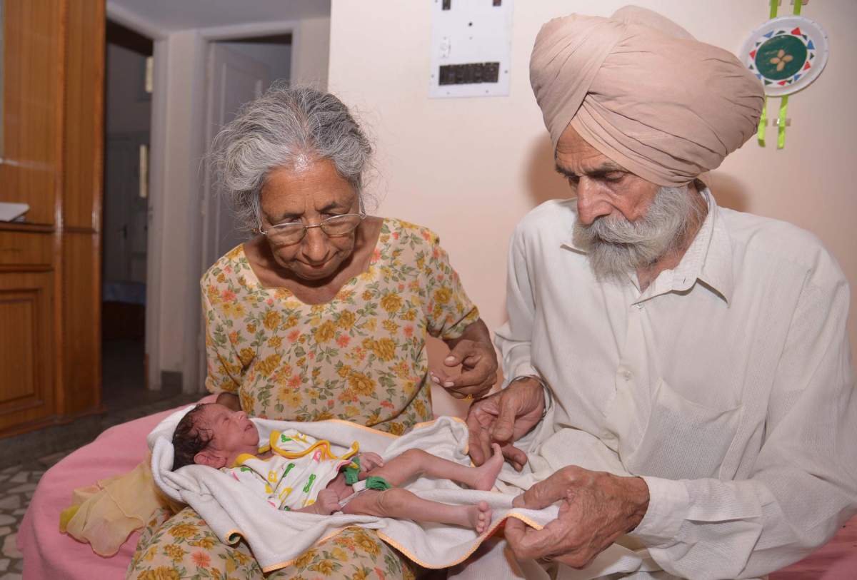 Indian parents Mohinder Singh Gill (L), 79, and Daljinder Kaur, 70, pose for a photograph as they hold their newborn baby boy Arman at their home in Amritsar on May 11, 2016.
The new mother said her life was now complete. 
