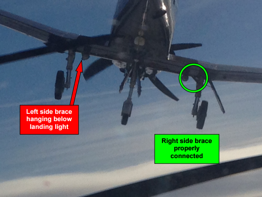 Chase plane photo shows damage to the CT156 Harvard II landing gear.