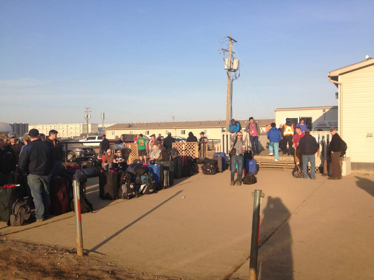 Workers at Black Bear Lodge oilsands camp wait to be flown out of the camp to accommodate Fort McMurray evacuees.