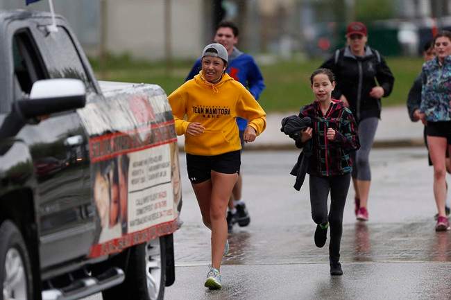 Kayleen McKay arrives with students from West Kildonan at the Alexander Docks in Winnipeg on Tuesday.