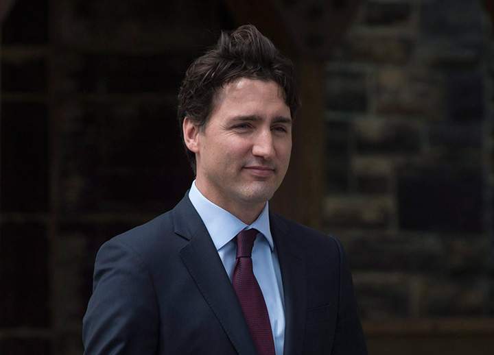 Prime Minister Justin Trudeau walks to a motorcade as he leaves Parliament Hill in Ottawa, Wednesday, May 4, 2016. 