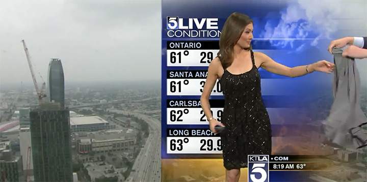 Female meteorologist handed sweater to cover bare shoulders during live weather report - image