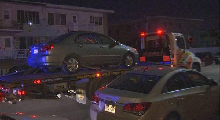A car is being towed during an overnight police operation in Lasalle. Saturday, May 7, 2016. Photo Courtesy of TVA